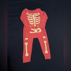 Baby Gap pink skeleton pajamas in size kids 2. Like new